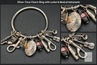 Silver-Tone Charm Ring with Locket, Musical Instruments & Swivel Clips Includes miniature instrument charms, a bell and floral bead.