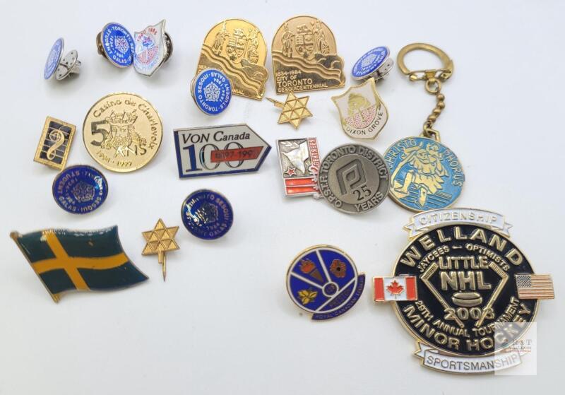 Collection of Commemorative Enamel Lapel Pins and Keychain from Various Canadian Events and Organizations