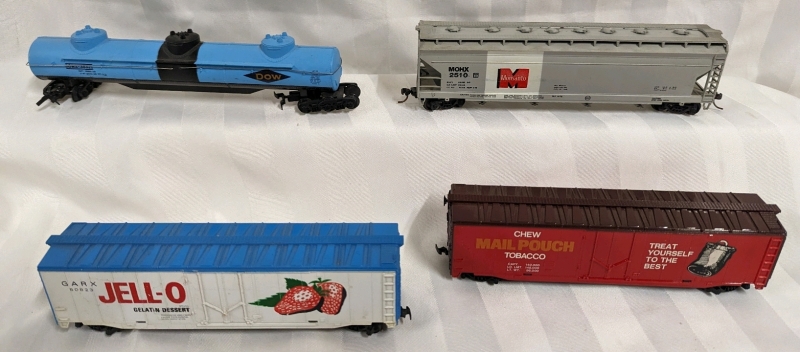 4 Advertising Toy Train Cars. HO Scale