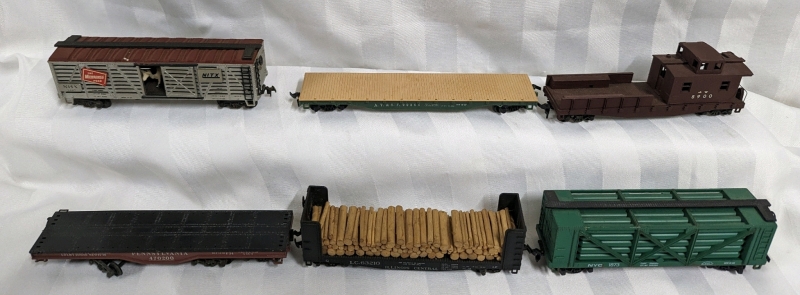 6 Toy Train Cars. HO Scale.