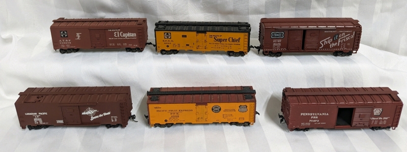 6 Toy Train Cars. HO Scale