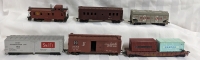 6 Toy Train Cars. HO Scale