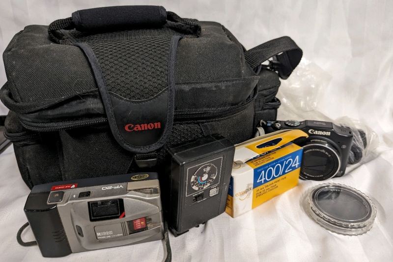 Cameras + Accessories and bag.