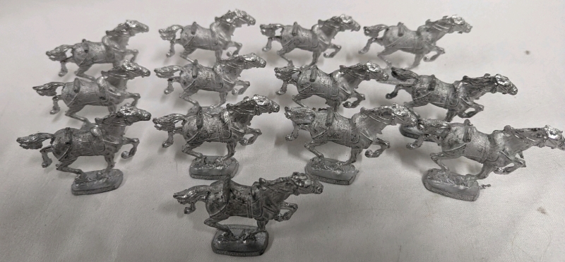 13 Unpainted Lead Horse Miniatures.