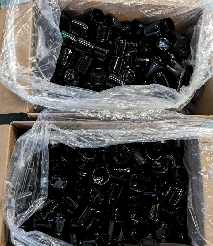 Over 400 Small Dark Green Plastic Pots.