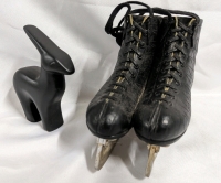 Decorative Ice Skates and Earthenware Animal Statue.