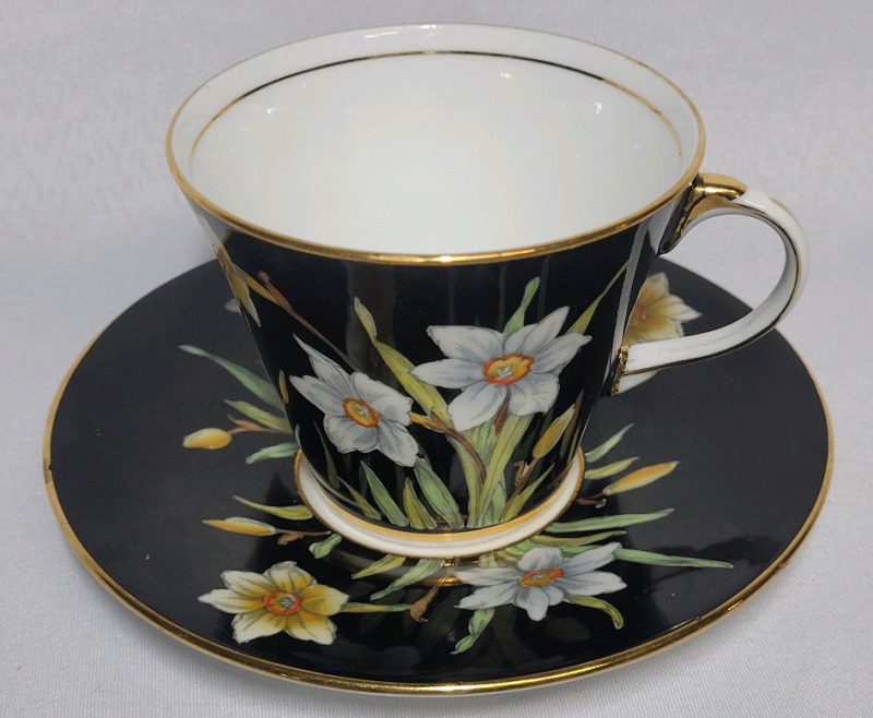 Aynsley ' Daffodils ' Cup & Saucer , Both Ring True . Small Chip on Bottom of Saucer