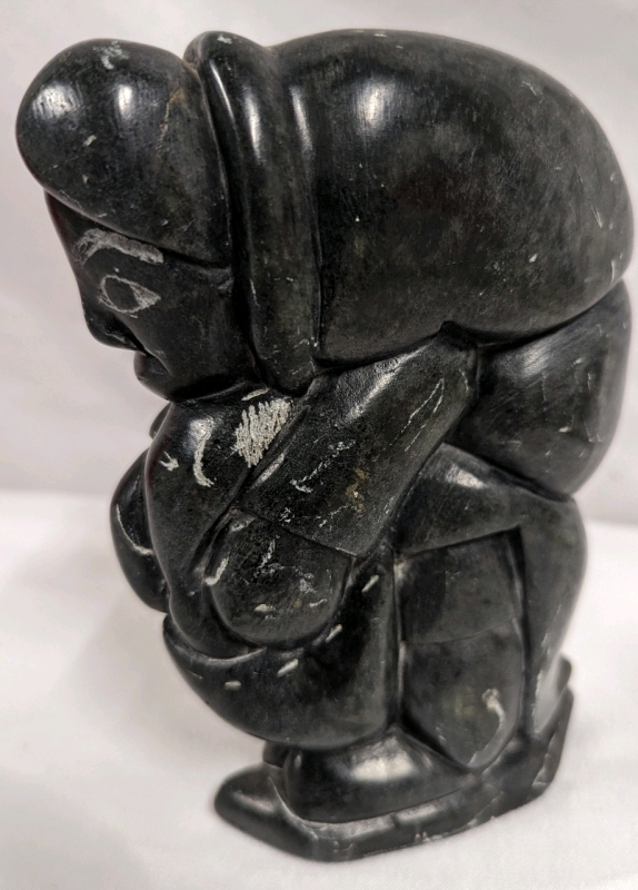 Singed & Numbered Inuit Soapstone Carving of Man with Fish.