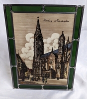 Hand crafted wood carving & stain glass window of "Freiburg Cathedral."