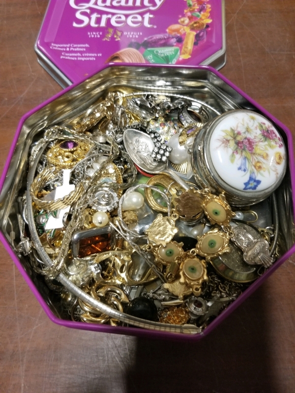 Small tin of jewelry