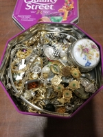 Small tin of jewelry