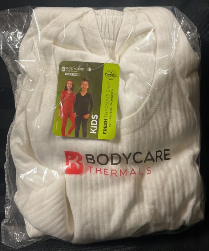 NEW with tags BodyCare Thermals Quilt Range Kids size 70 cm colour White includes top and bottoms