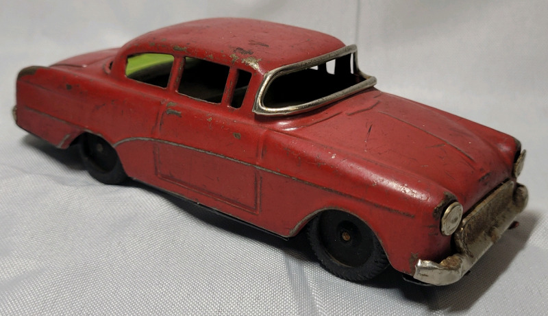 Vintage OPEL Tin Friction Car , measures 5.5"&times;2" . Friction Back Wheels Not Working