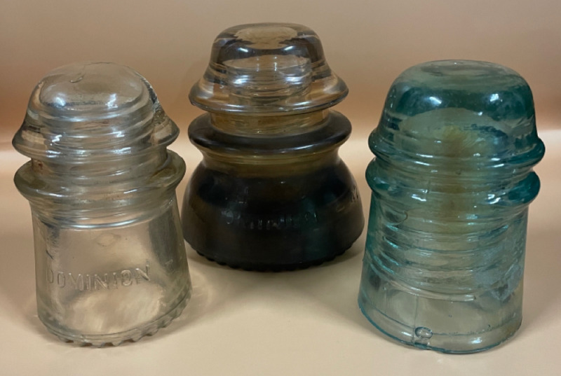 3 Vintage Glass insulators range from 4.5&rdquo; tall to 4&rdquo; tall