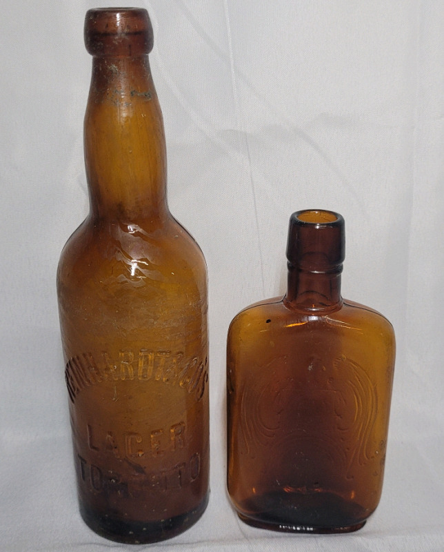 Vintage Amber Bottles , measures 6.5" & 9 3/4" tall .