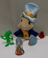 Vintage Jiminy Cricket Figure Jiminy Cricket Plushie and a Snow Globe.