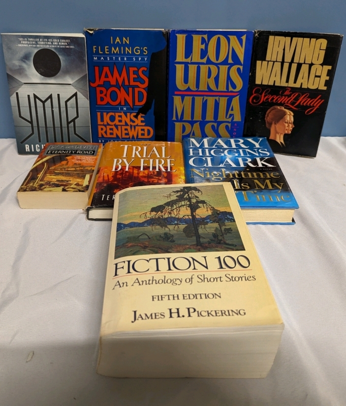 A Collection of 8 Hardcover and Softcover Books.