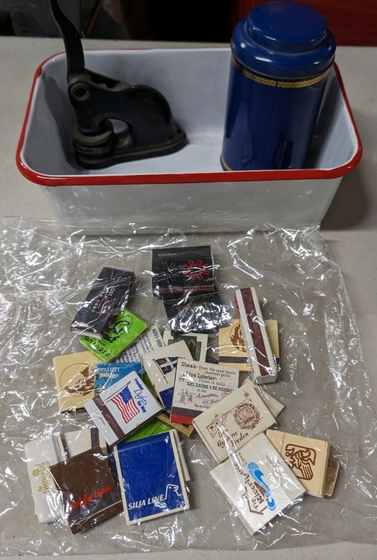 Enamel tub, tin, stamp, and assorted matchbooks.