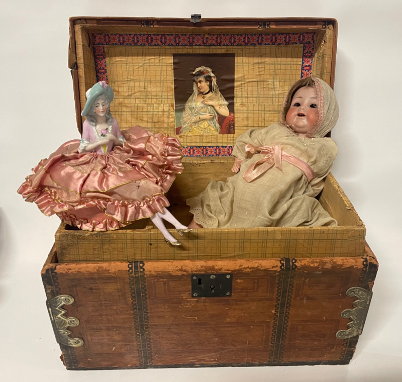 Antique wooden chest with hidden compartment and two vintage dolls