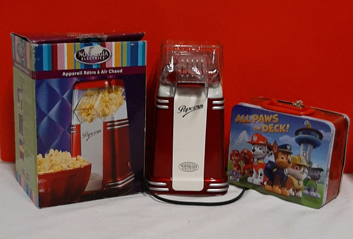 Nostalgia Electrics Popcorn Popper and a Paw Patrol Lunchbox.