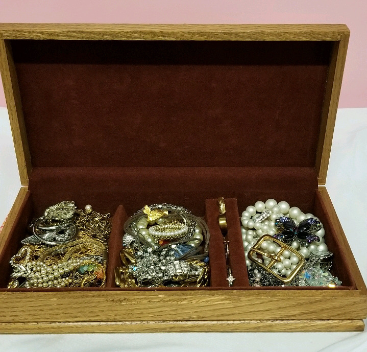 Vintage jewelry box with contents