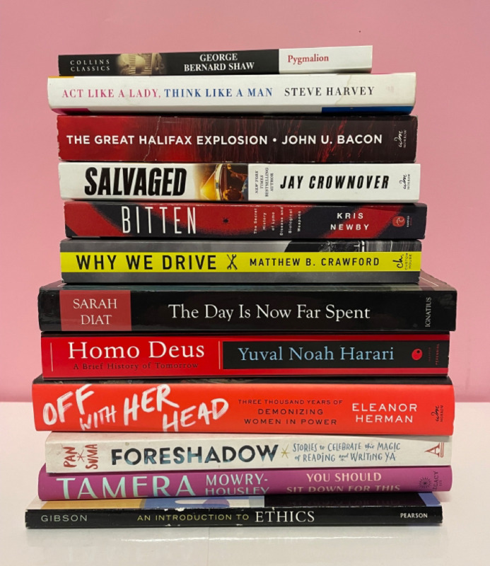 12 assorted soft and hard cover novels