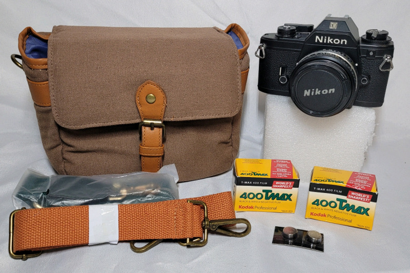 Vintage Nikon EM 35mm Camera w/55mm Lens , 2 New Film Rolls & Camera Bag , Working