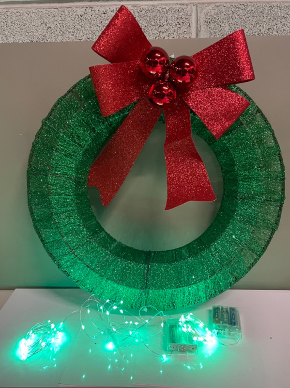 Glittery Christmas Wreath with two sets of peekaboo green lights