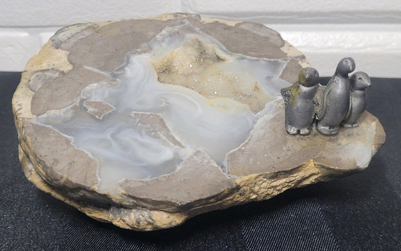 Geo Rock with Lead Penguin Art Piece . Measures 4.5" diameter