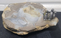 Geo Rock with Lead Penguin Art Piece . Measures 4.5" diameter