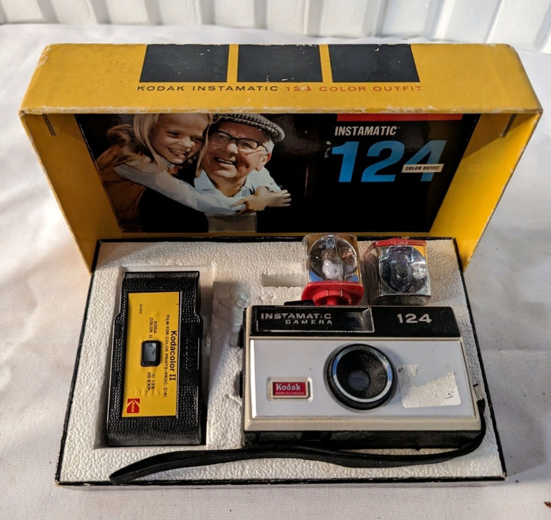 Vintage Kodak Instamatic in original box with 2 flashes and an empty Kodacolor II canister.