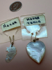 Four Carved Pearl Pendants in Velvet Box - 2