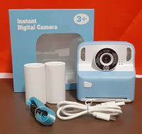 New Instant Digital Camera for Ages 3 and up Comes with Charging cable, camera strap and what I believe is film Untested