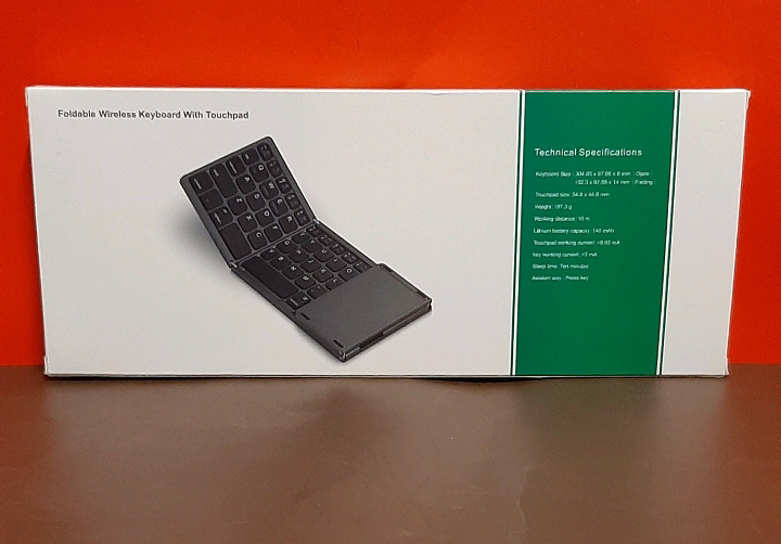 New Foldable Wireless Keyboard with Touchpad Comes with USB Cord and Small Stand