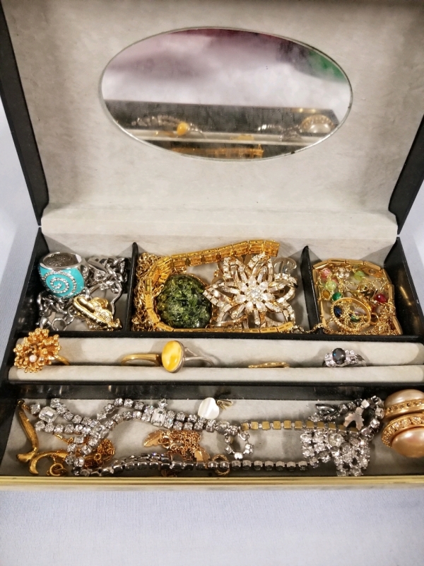 Vintage jewelry box with contents