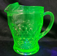 Vintage Uranium Depression Glass Water Pitcher , measures 8" Tall . No chips or cracks