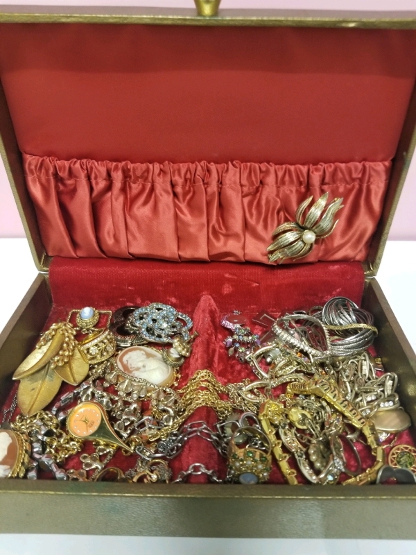 Vintage jewelry box with contents