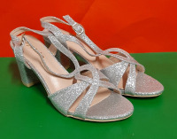 Sparky Silver Sandals with a 2.75 inch heel. No size on shoe but they measure 9" long