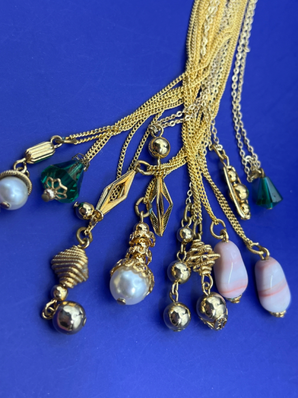 12 Vintage Necklaces on original Ring hook.