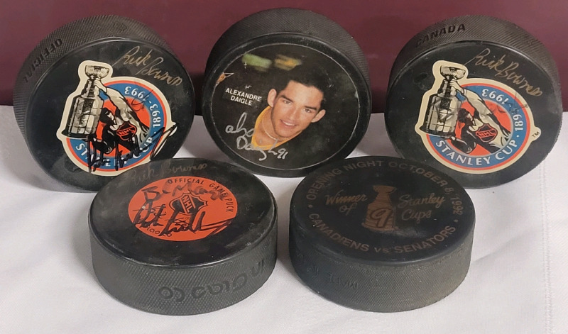 NHL Hockey Signed Hockey Pucks : Rick Bowness , Alex Daigle plus ??? . No COA