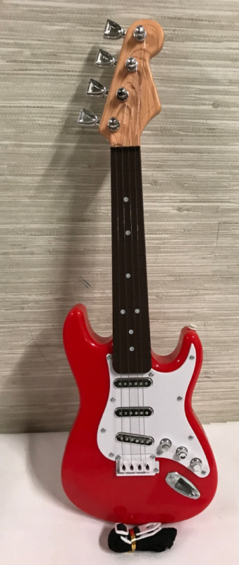 Red Toy Guitar 17 inches long needs Batteries like new