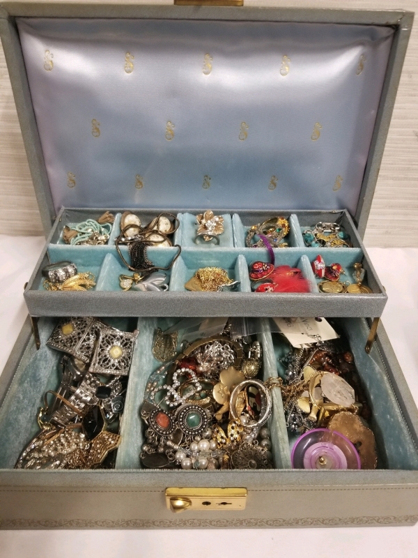 Vintage jewelry box with contents