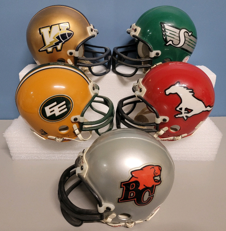 CFL Football West Team Mini Helmets by Riddel . Five (5) Helmets