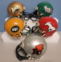 CFL Football West Team Mini Helmets by Riddel . Five (5) Helmets