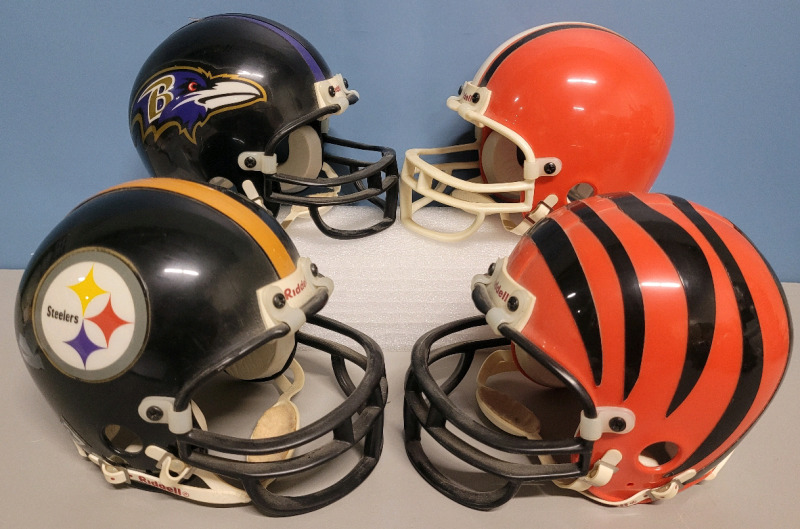 NFL Football AFC North Team Mini Helmets by Riddel . Four (4) Helmets