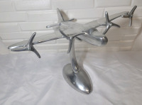 Vintage Cast Aluminum Airplane Desk Model Sculpture . Measures 12"×17"×12"