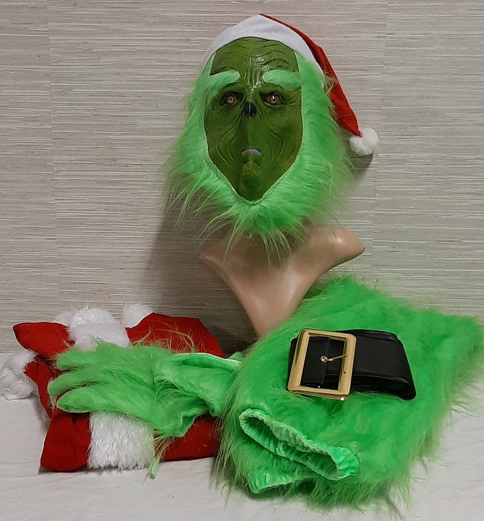 A Grinch Costume. If you're traveling to Whoville we've got you covered. Jacket is 24 inches from armpit to armpit and the waist on the pants have a 26" waist. The Velcro closures need some repair.