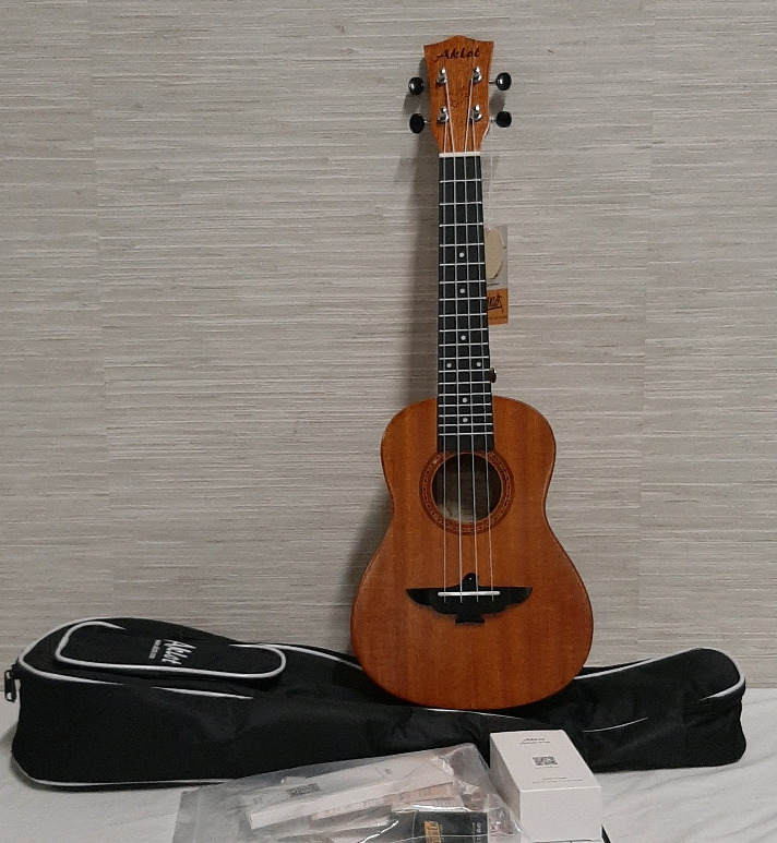 Aklot Ukelele Model AKC23 Comes with case tuner and other items