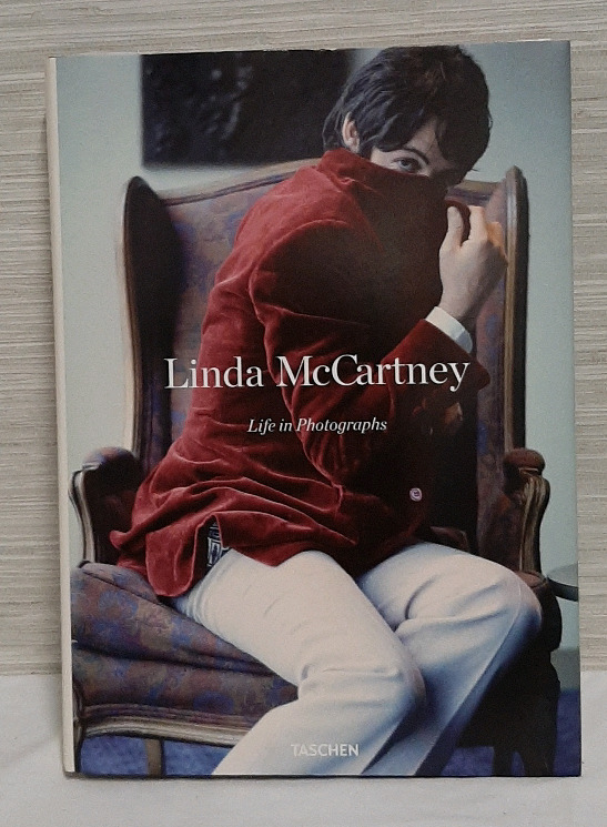 Linda McCartney A Life In Pictures A book filled with photographs of different musicians and bands, as well as the Beatles and family photographs