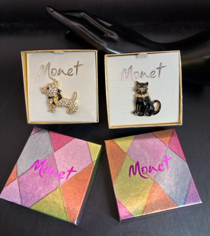 Two signed MONET figural Brooches Original Boxes